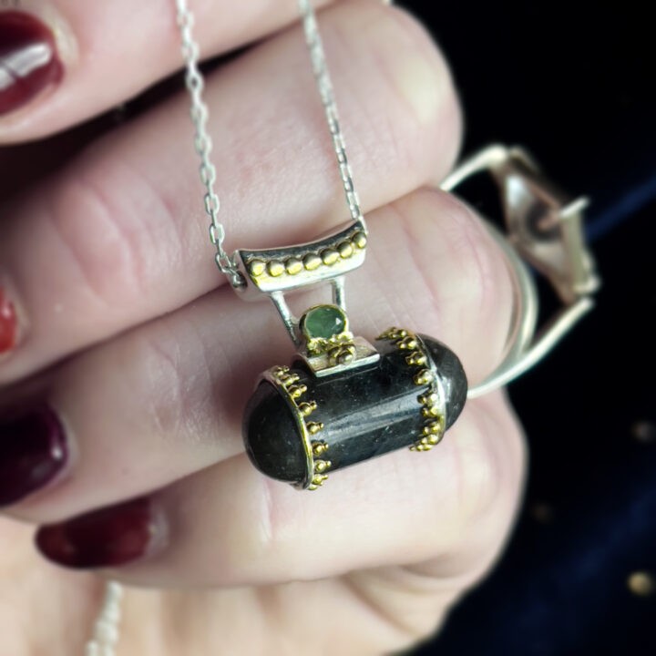 Gemstone Sale: Corundum Capsule Pendant with Emerald