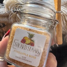Square Glass Jar with hinge style lid with sacred sugar inside.